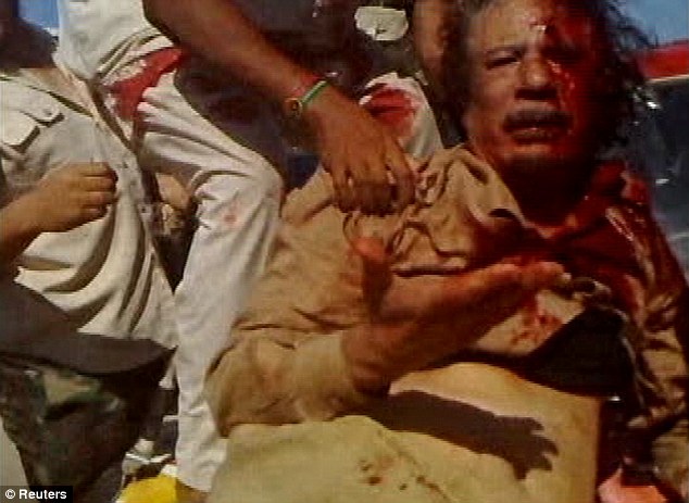 A still of Muammar Gaddafi's last moments alive, shortly before being killed  by Lybian rebels in Sirte. He died 6 years ago, on this day. : r/lastimages