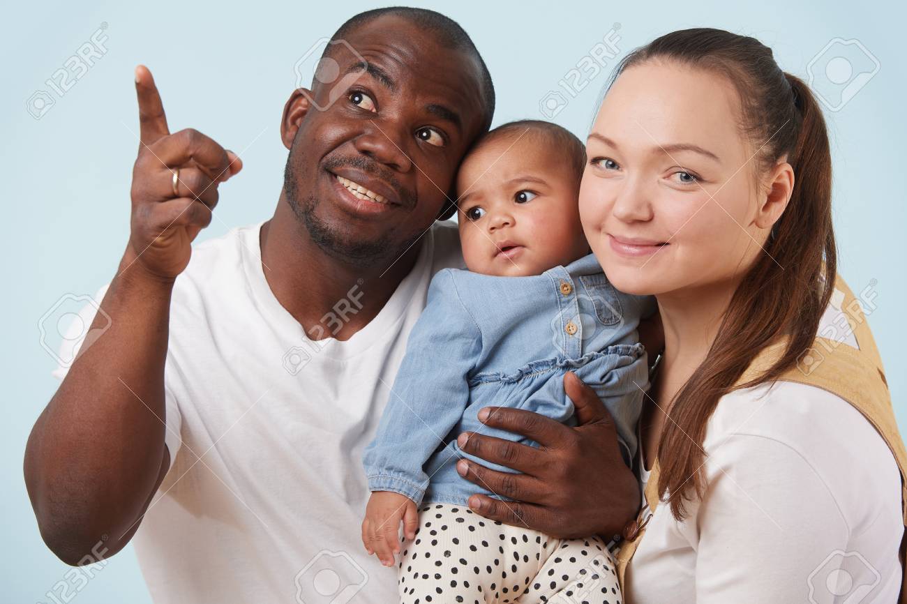 116030676-portrait-of-happy-multiethnic-family-white-mother-black-father-and-their-little-baby...jpg
