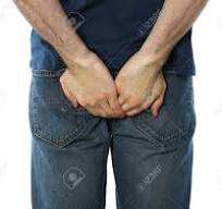 Man Holding His Butt, Isolated On White Background Stock ...