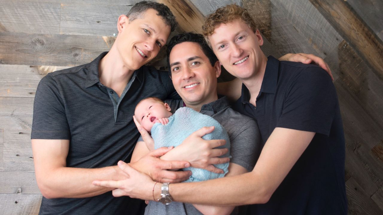 210303113943-01-throuple-three-dads-and-baby.jpg