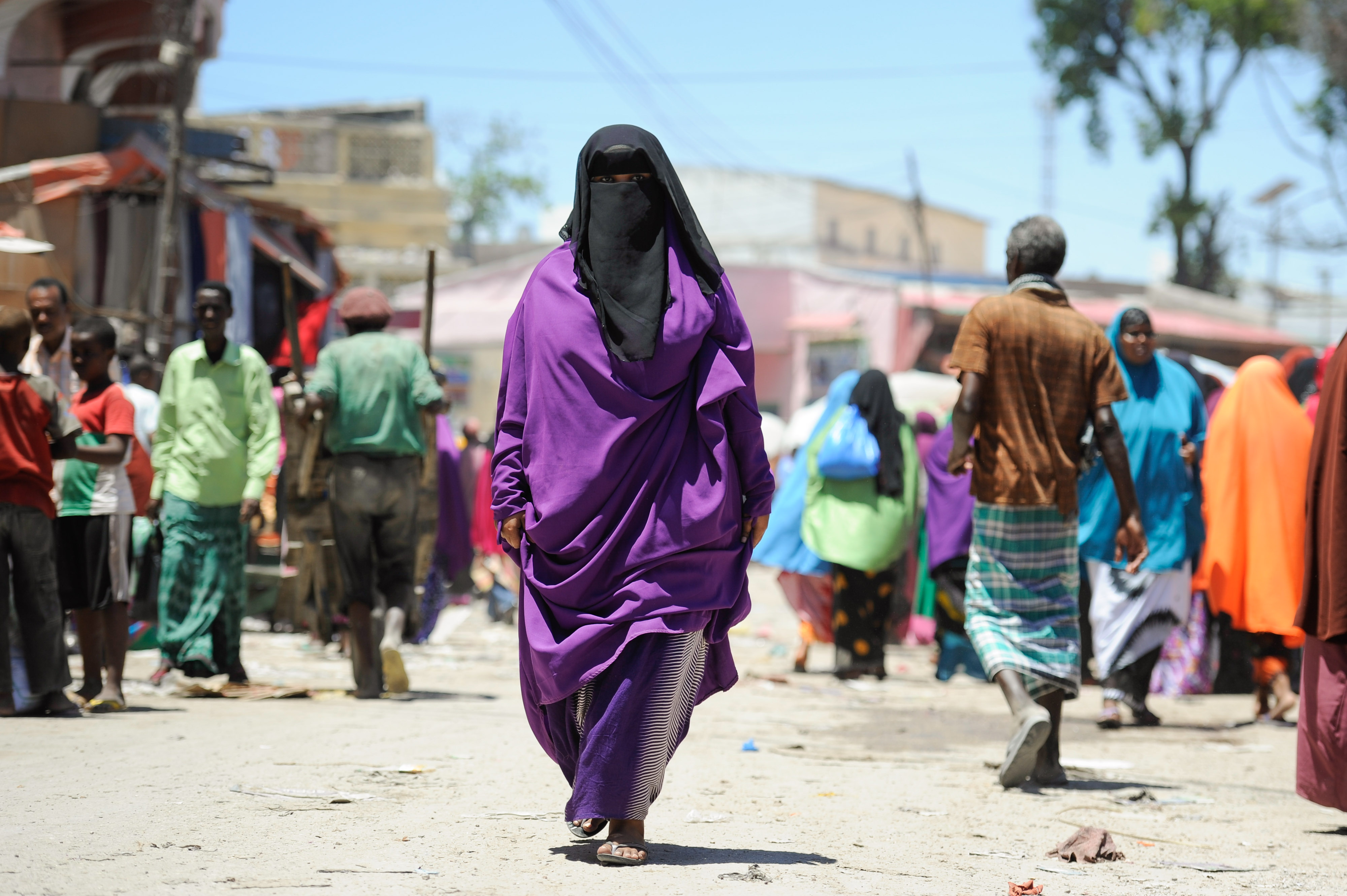 A_Somali_woman_walks_down_the_street_in_Mogadishu's_Hamar_Weyne_market_on_October_3._Ahead_of_...jpg