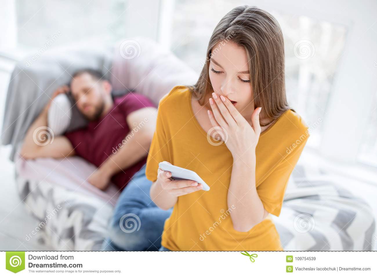 bad-news-good-looking-baffled-long-haired-young-women-feeling-surprised-holding-her-mans-phone...jpg