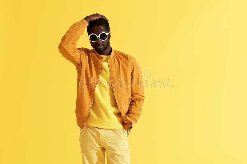 fashion-portrait-black-man-clothes-sunglasses-background-stylish-yellow-handsome-african-ameri...jpg