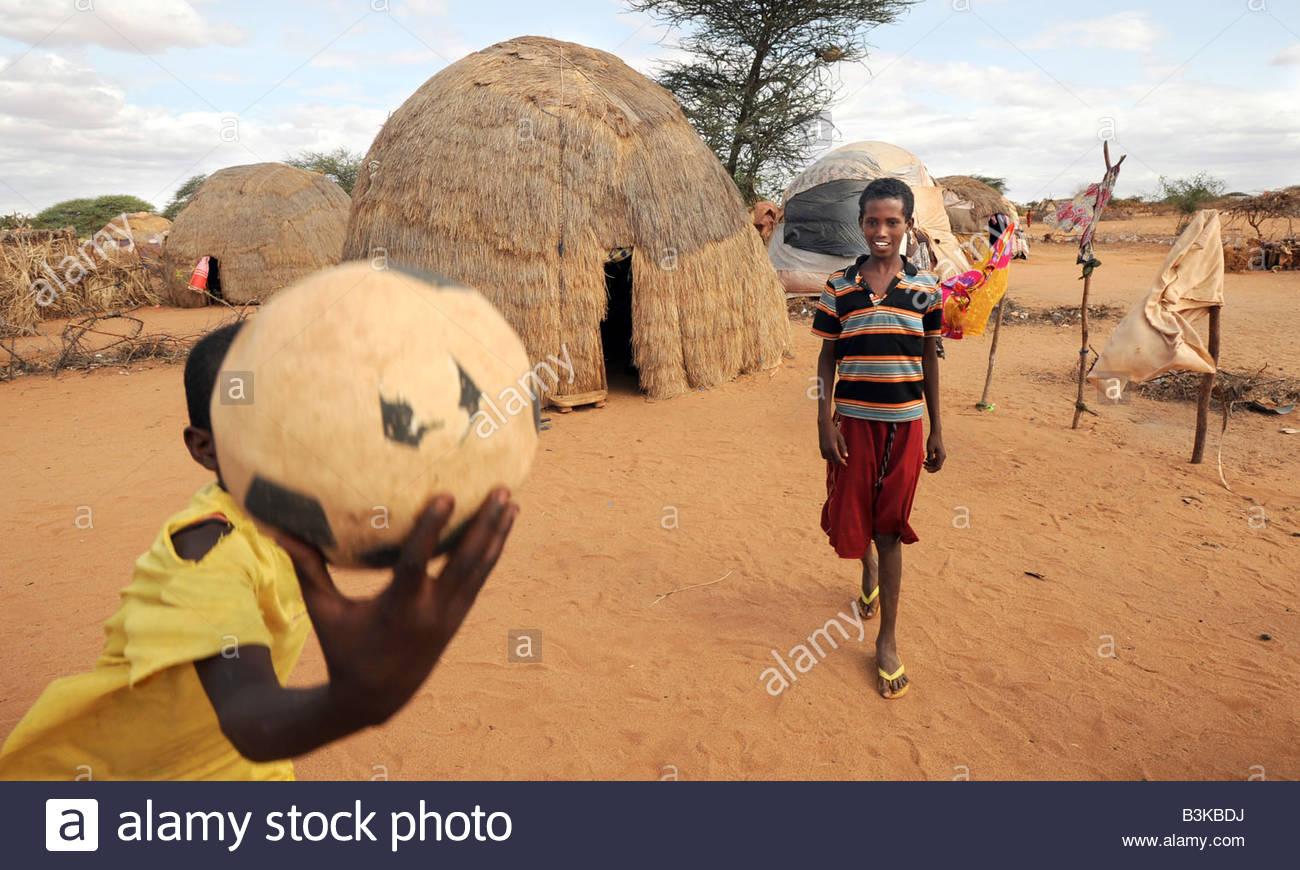 idle-abdi-lahi-12-holding-ball-and-mohammed-nor-abdi-at-belet-amin-B3KBDJ.jpg
