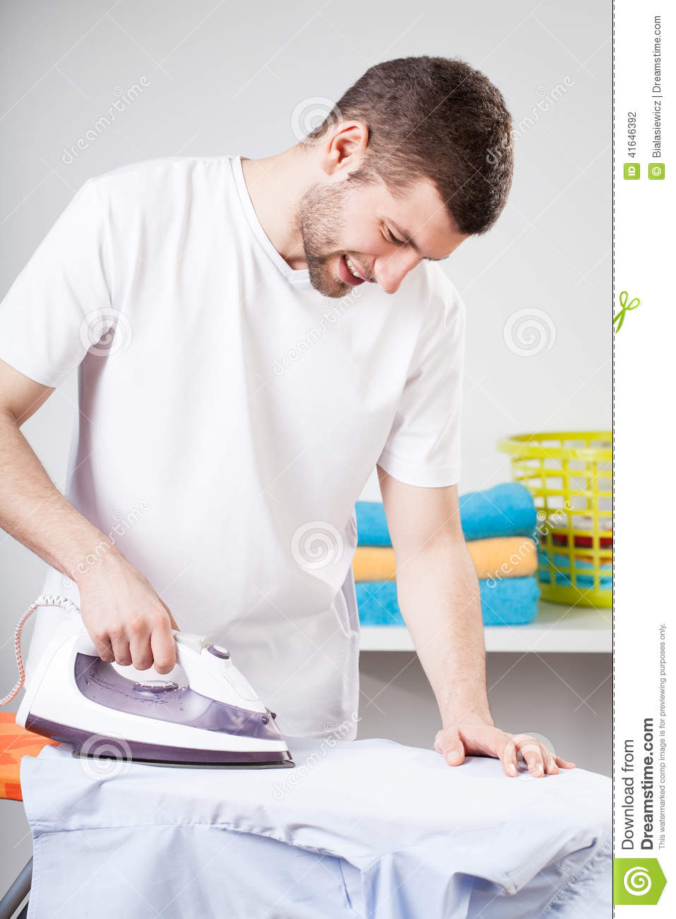 man-doing-household-chores-handsome-ironing-as-his-chore-41646392.jpg