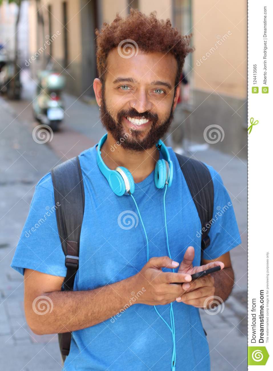 mixed-race-guy-smiling-outdoors-124413565.jpg
