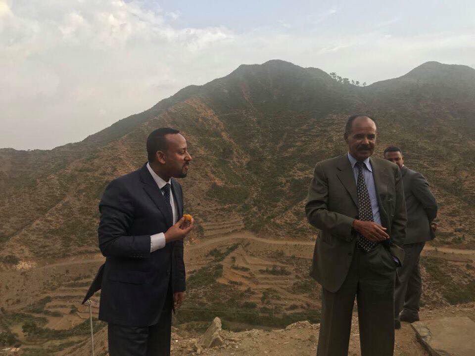 PM-Abiy-Ahmed-Eating-Beles-Eritrea[1].jpg