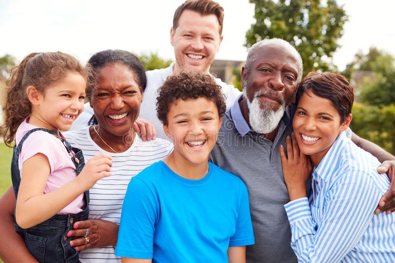 portrait-smiling-multi-generation-mixed-race-family-garden-home-166573693.jpg