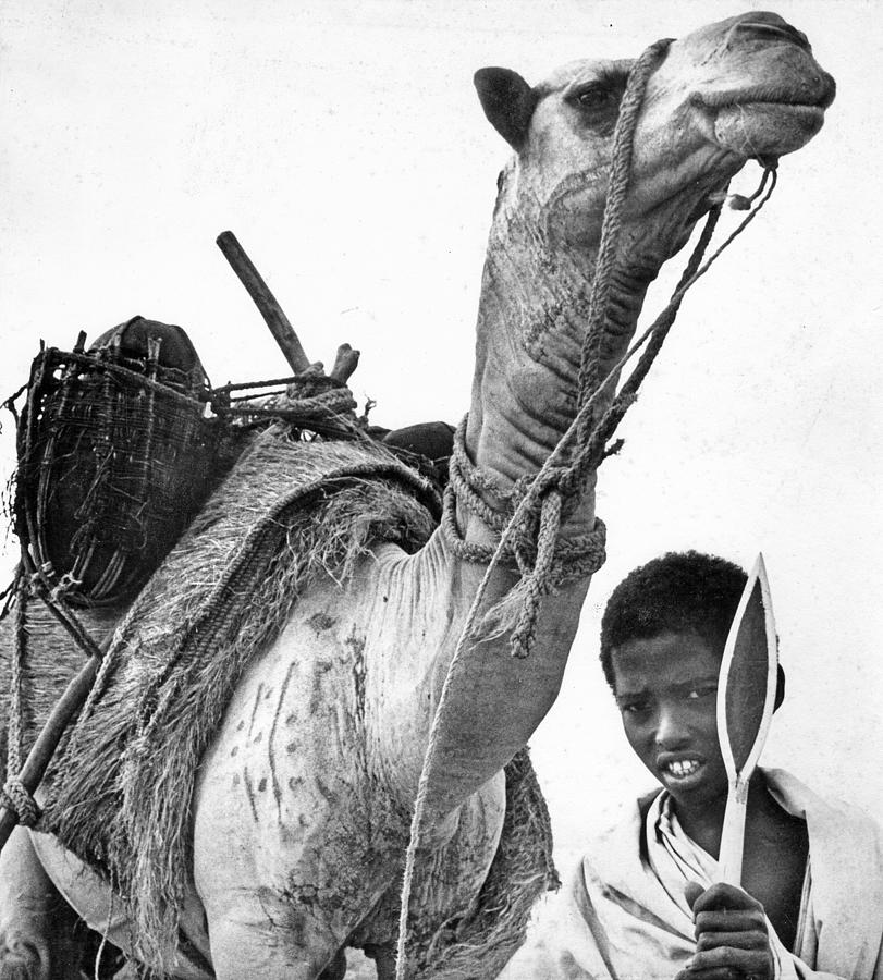 somali-nomadic-boy-and-camel-milk-container-spear-blair-seitz.jpg