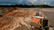 An unlicensed miner takes a break while working in a tin mining area in Toboali, on the southern shores of the island of Bangka, Indonesia,