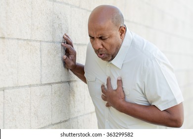 man-having-heart-attack-260nw-363299582.jpg