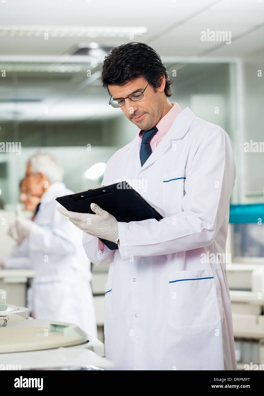 male-researcher-reading-clipboard-DRPMP7.jpg