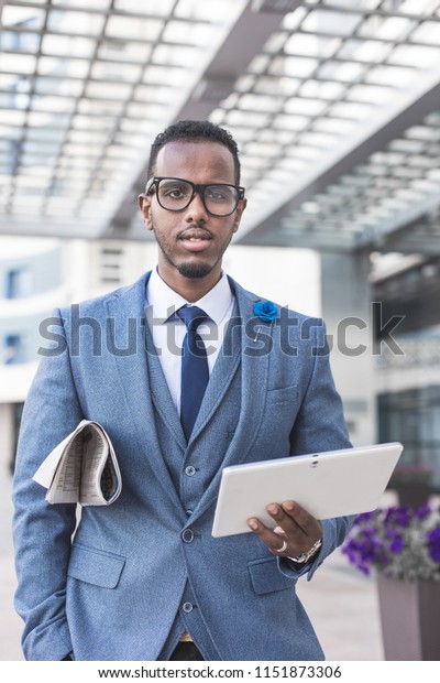 black-man-businessman-business-suit-600w-1151873306.jpg