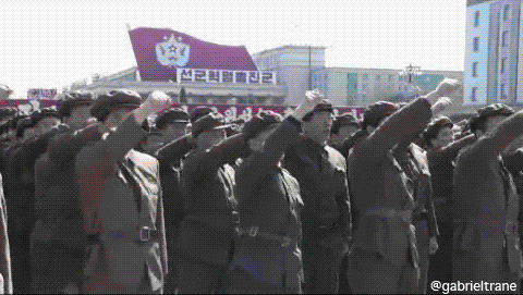 North-Korean-soldiers-pump-fist-in-Kim-Il-sung-square-in-Pyongyang.gif
