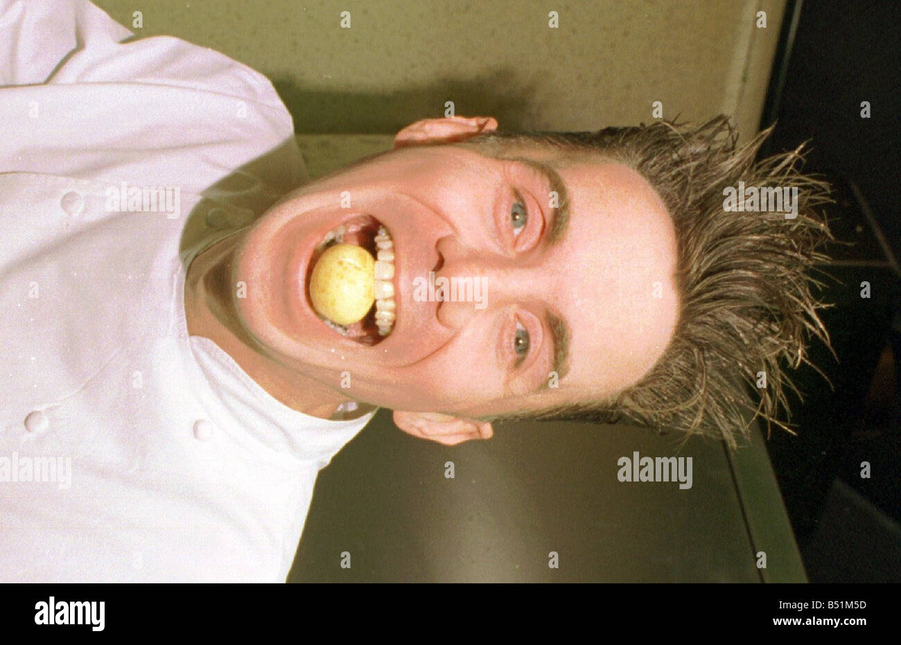 gary-rhodes-with-a-small-potato-in-his-mouth-B51M5D.jpg
