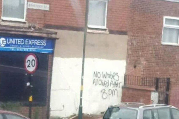 Racist-graffiti-on-wall-638170.jpg