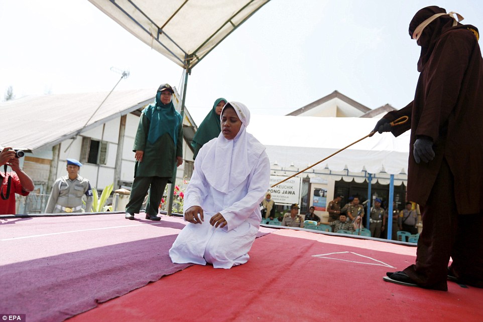 3CC12F4B00000578-4183428-An_Indonesia_woman_is_brought_on_to_a_public_stage_in_Banda_Aceh-a-18_1486030040575.jpg
