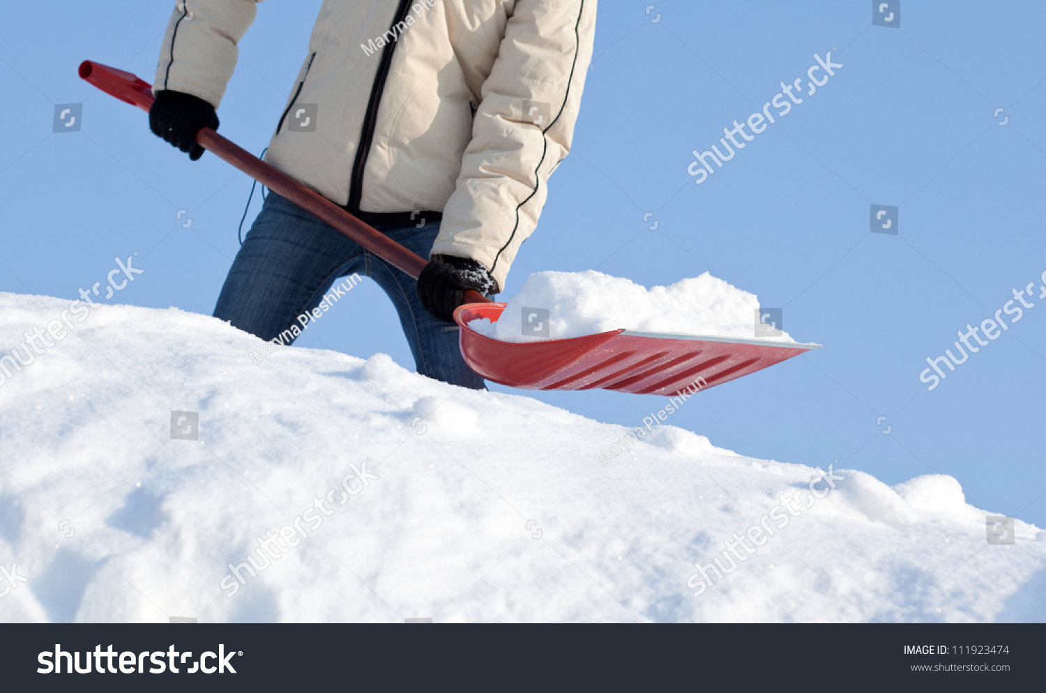 stock-photo-removing-snow-with-a-shovel-after-snowfall-111923474.jpg