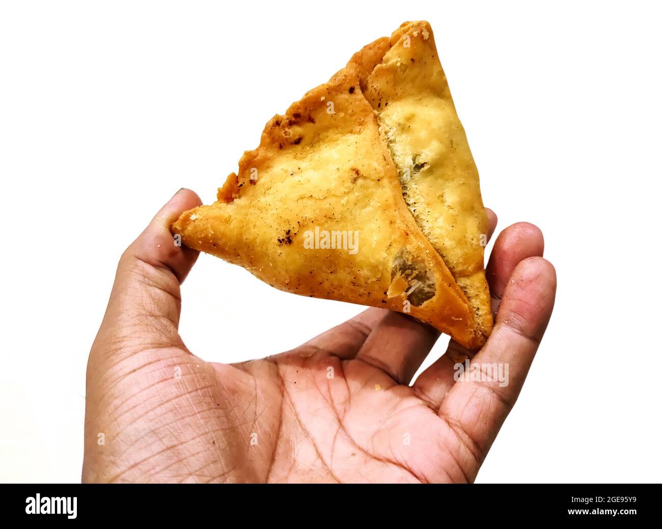 a-man-holding-fried-samosa-in-hand-isolated-on-white-background-2GE95Y9.jpg