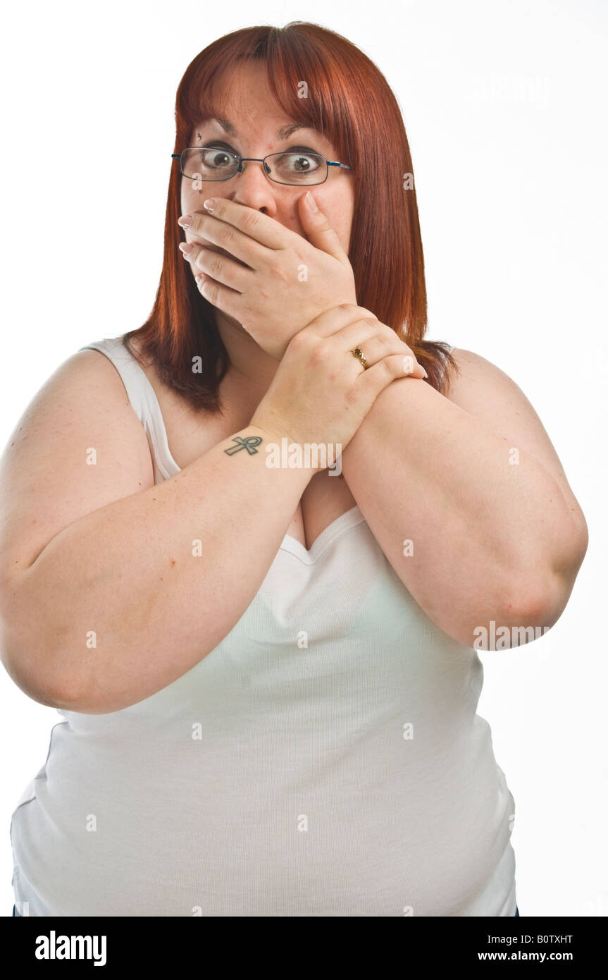 fat-young-woman-looking-shocked-hand-over-her-mouth-gagged-gagging-B0TXHT.jpg