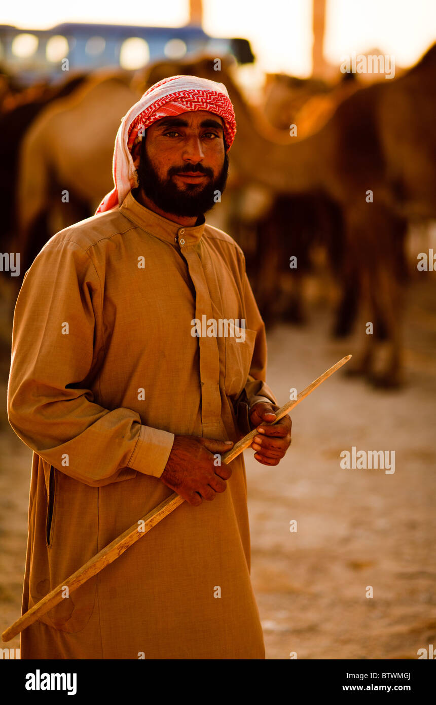 an-arabian-bedouin-in-syria-herding-his-camels-BTWMGJ.jpg