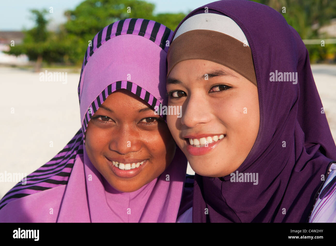 muslim-girls-with-big-smiles-on-mabul-island-in-borneo-malaysia-C4W2HY.jpg