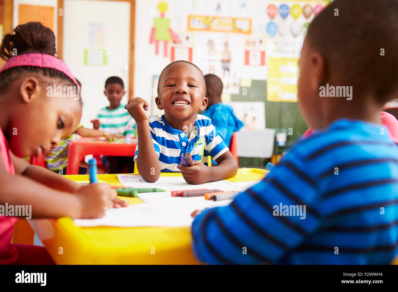 preschool-class-in-south-africa-boy-looking-to-camera-F2WWH4.jpg