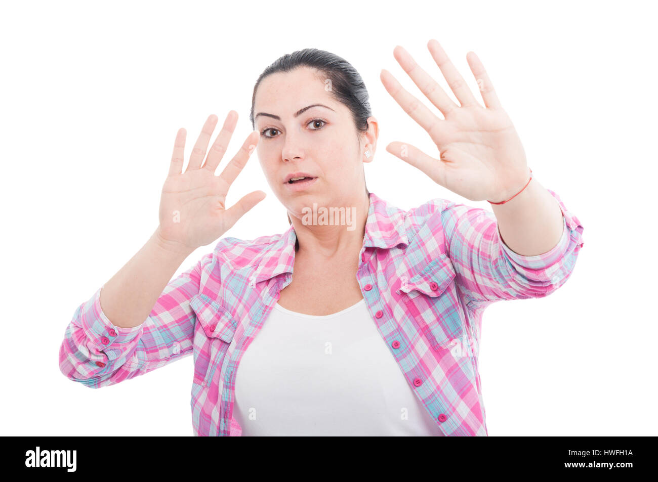 scared-woman-raising-hands-up-in-defense-as-danger-concept-isolated-HWFH1A.jpg