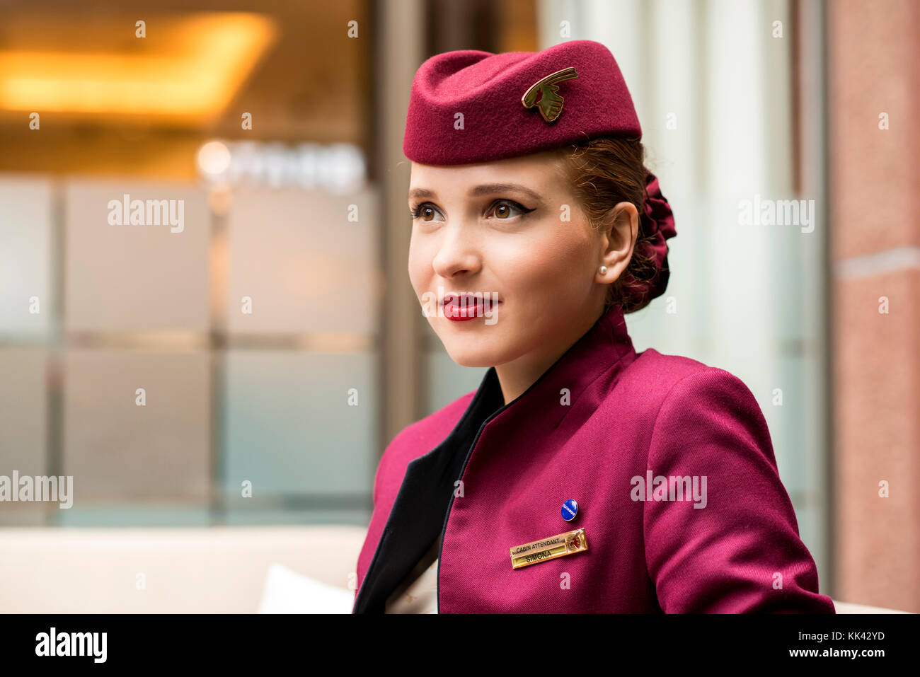 young-attractive-female-working-as-cabin-crew-for-qatar-airways-on-KK42YD.jpg