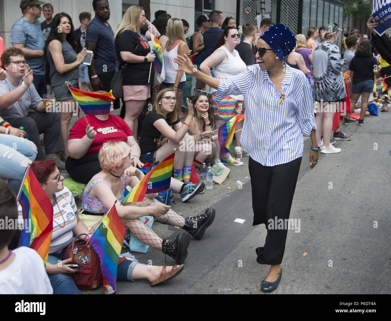 minneapolis-minnesota-usa-24th-june-2018-state-rep-ilhan-omar-the-dfl-endorsed-candidate-for-the-us-5th-congressional-district-campaigns-at-the-pride-parade-in-minneapolis-mn-credit-craig-lassigzuma-wirealamy-live-news-P6DT4A.jpg