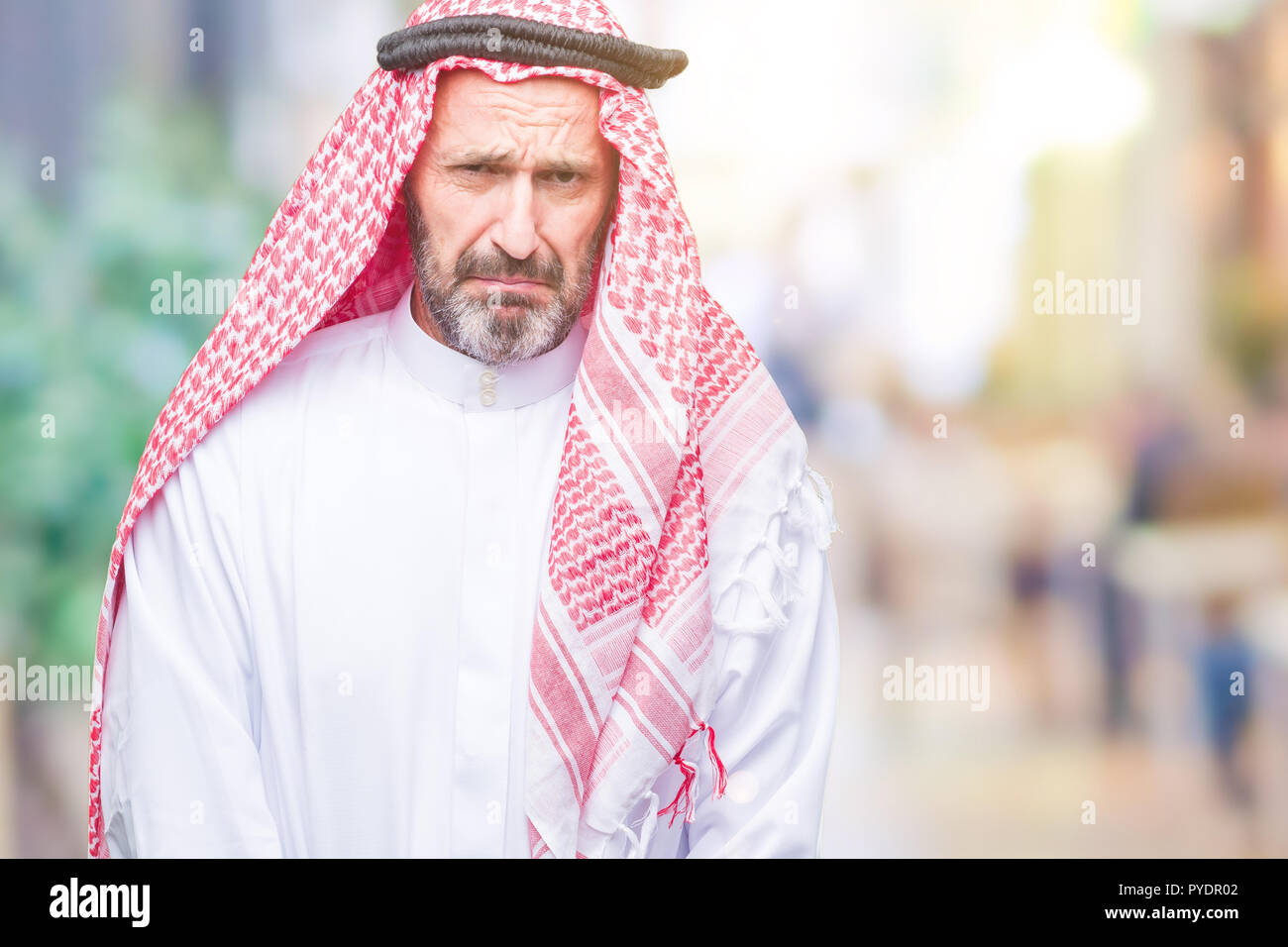 senior-arab-man-wearing-keffiyeh-over-isolated-background-depressed-and-worry-for-distress-crying-angry-and-afraid-sad-expression-PYDR02.jpg