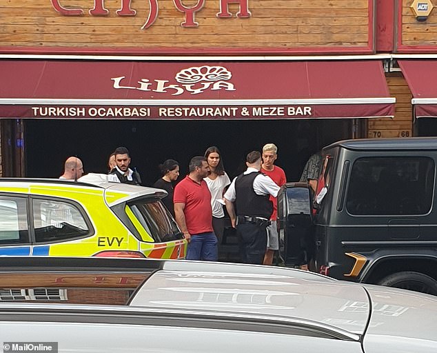 16505712-7286917-Mesut_Ozil_was_pictured_talking_to_officers_outside_Turkish_rest-a-61_1564088401251.jpg