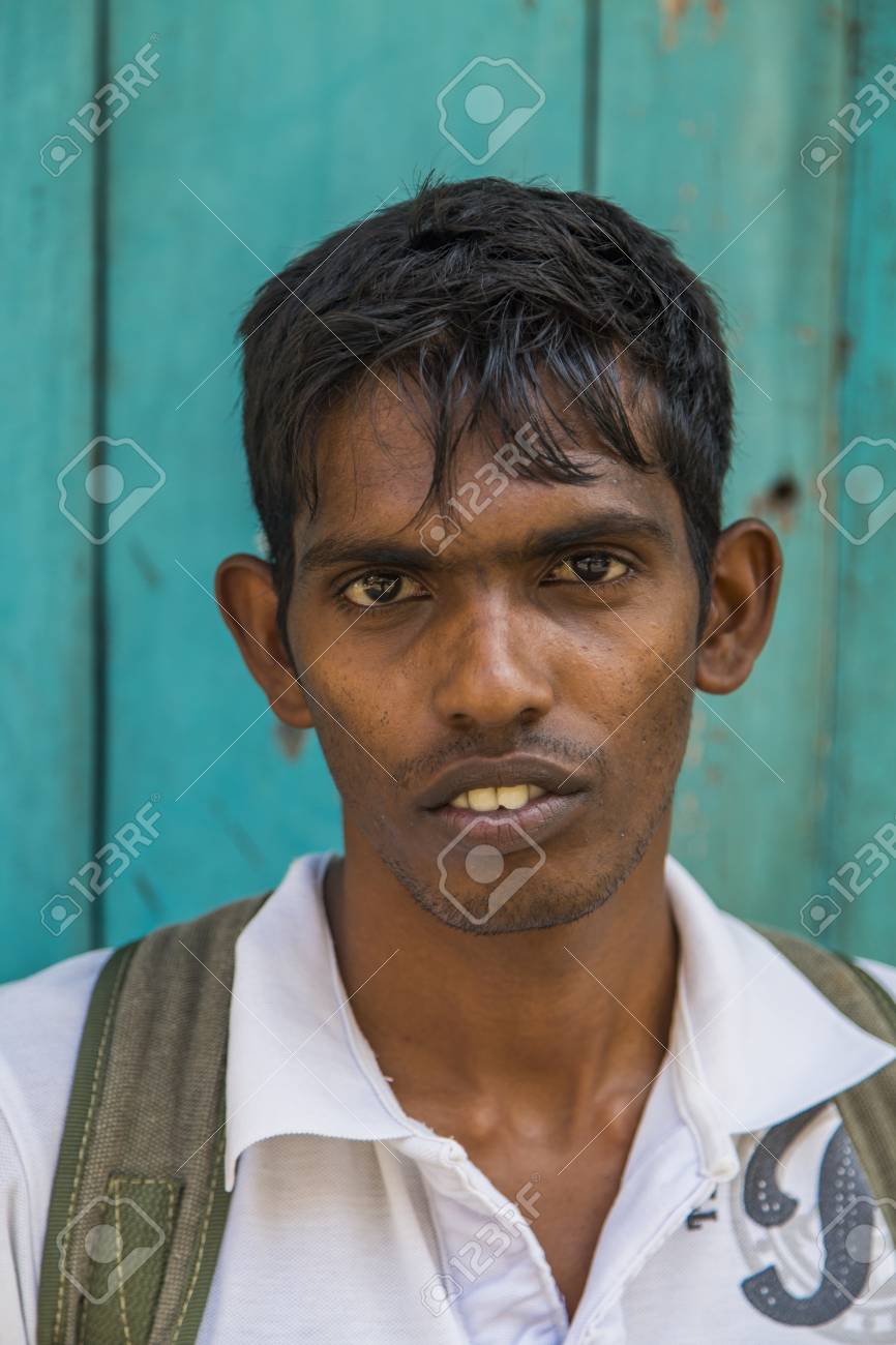 99493439-galle-sri-lanka-january-24-2014-unidentified-man-on-the-street-of-galle-sri-lanka-with-100-000-peopl.jpg