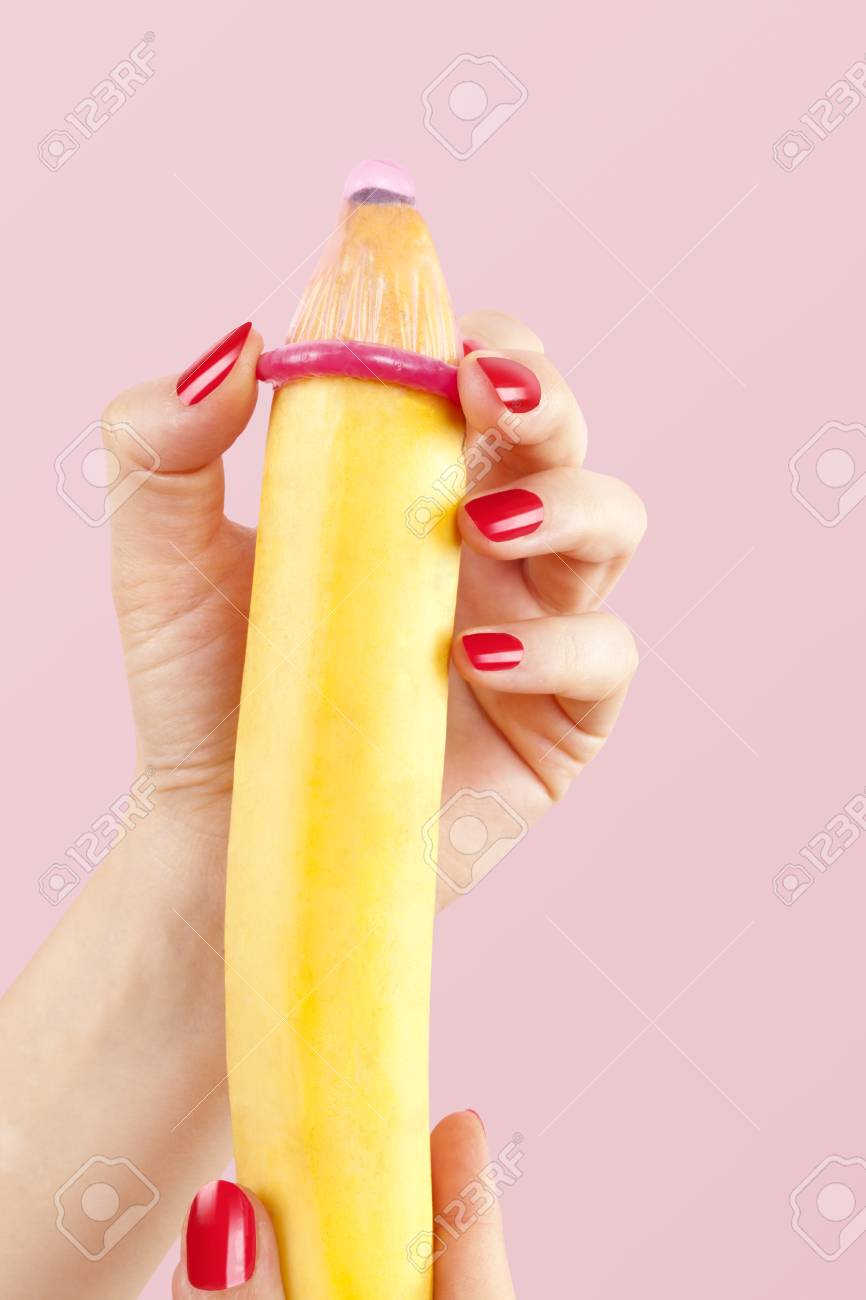50550646-female-hand-with-red-fingernails-puts-on-a-condom-onto-a-banana-safe-sex-concept-.jpg