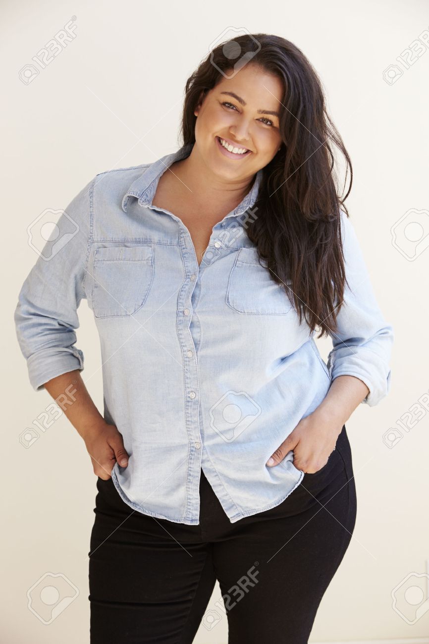 33545646-studio-portrait-of-smiling-overweight-woman.jpg