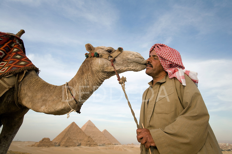 egyptian-man-camel-pyramids-giza-2.jpg