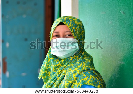 stock-photo-kuala-lumpur-malaysia-january-hijab-woman-wear-face-mask-during-air-pollution-568440238.jpg