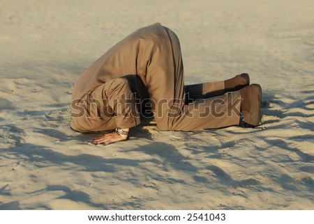 stock-photo-business-man-with-his-head-buried-in-the-sand-2541043.jpg