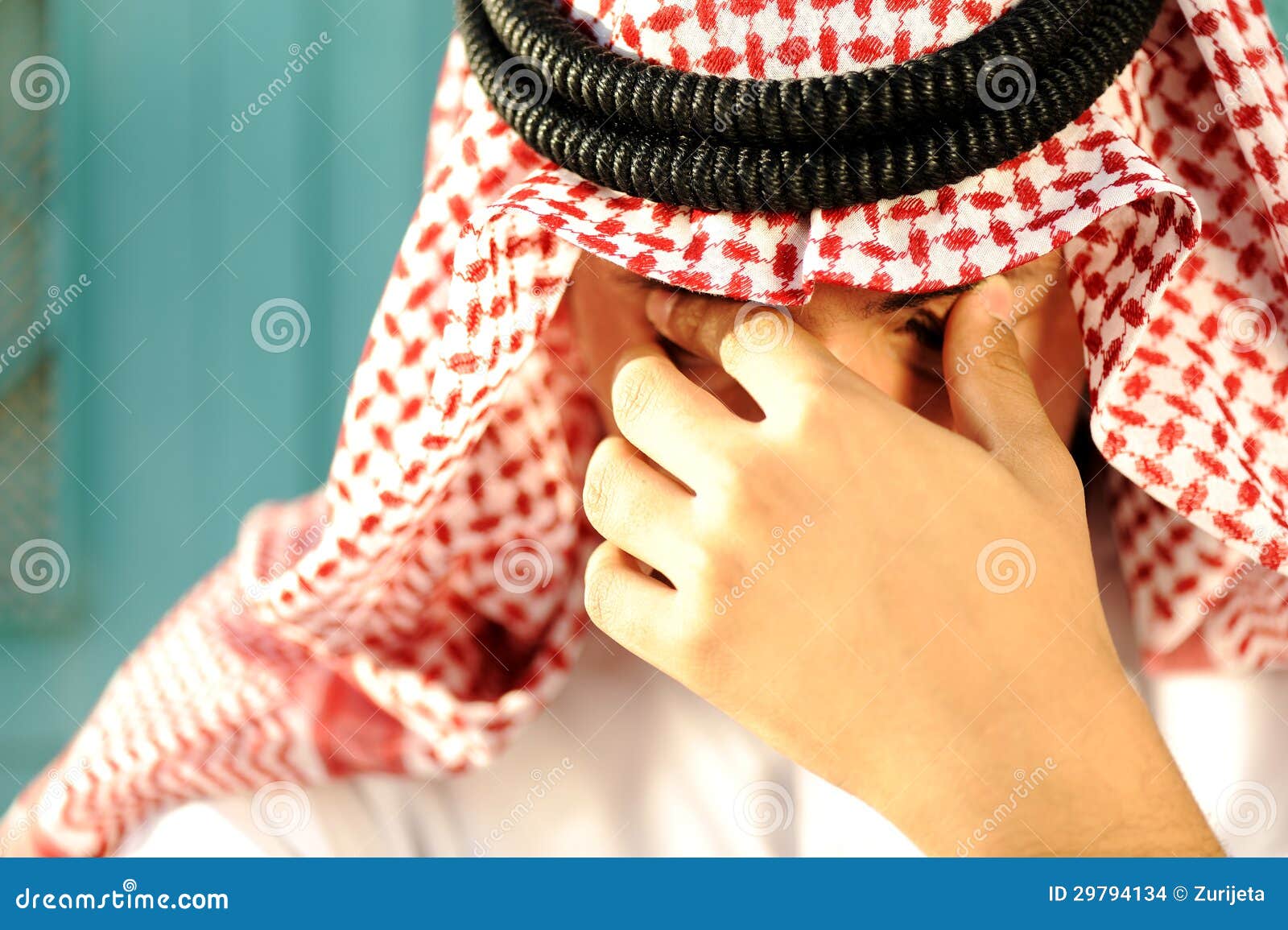 stressed-arabic-man-sad-cry-29794134.jpg