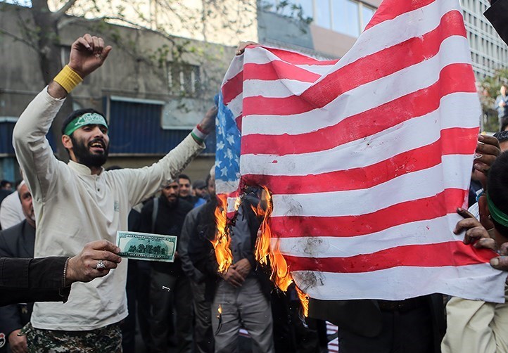 Iranian_Protesters_Burning_USA_Flag.jpg